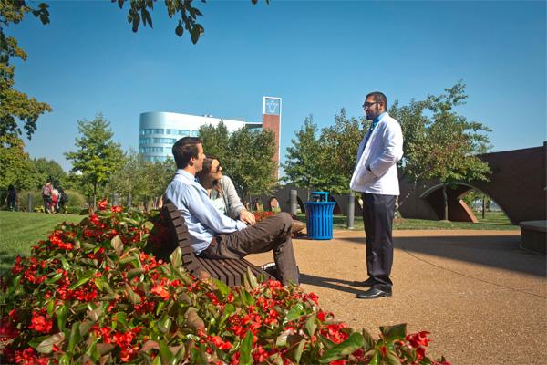 Students sitting outside outside Doisy Research Center